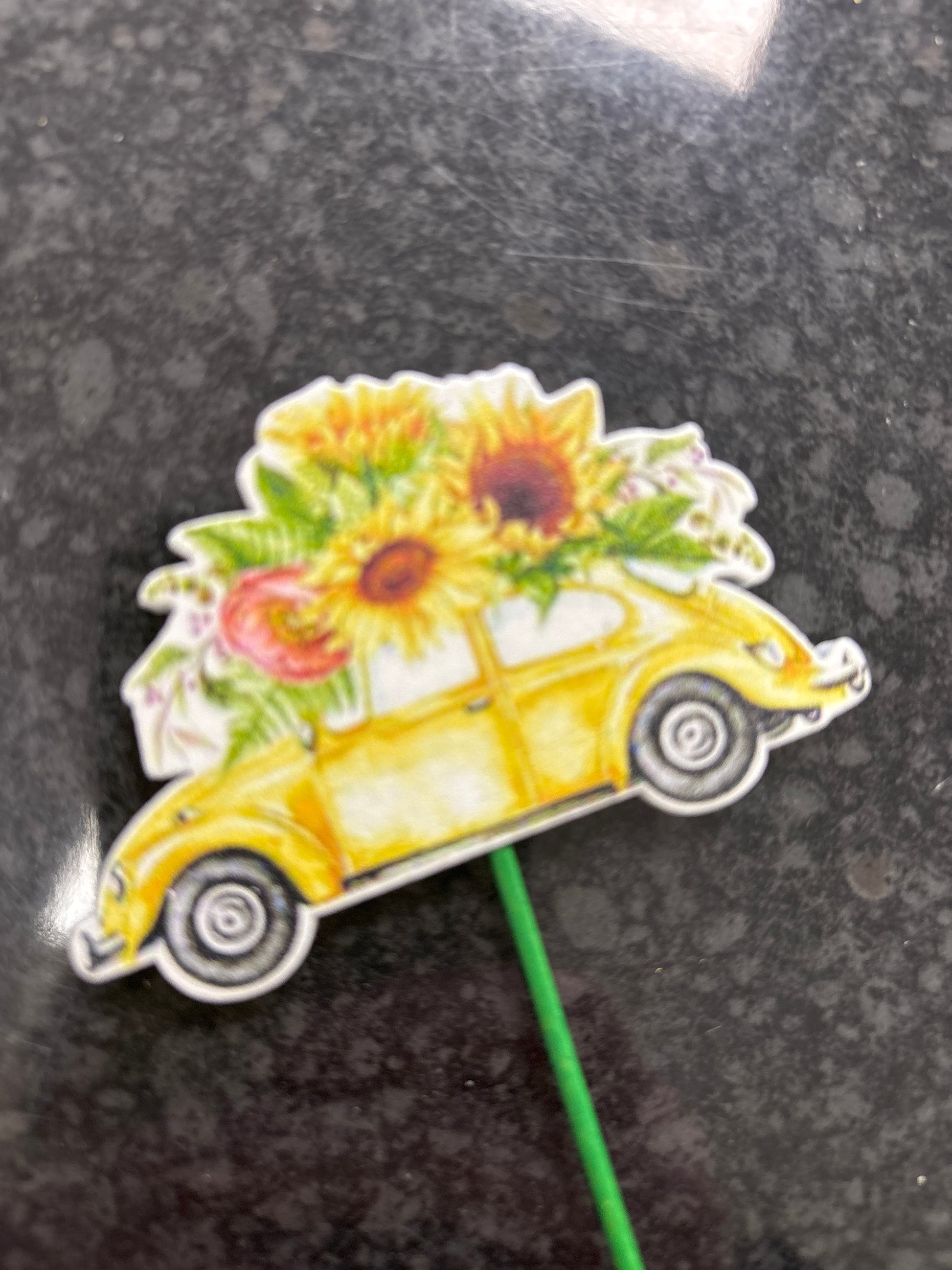 “Driving Miss Daisy” Zinc bucket containing fresh flowers and a car pick in the flowers!