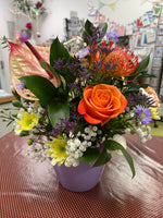 Fresh flowers, floral arrangement in a bright ceramic pot